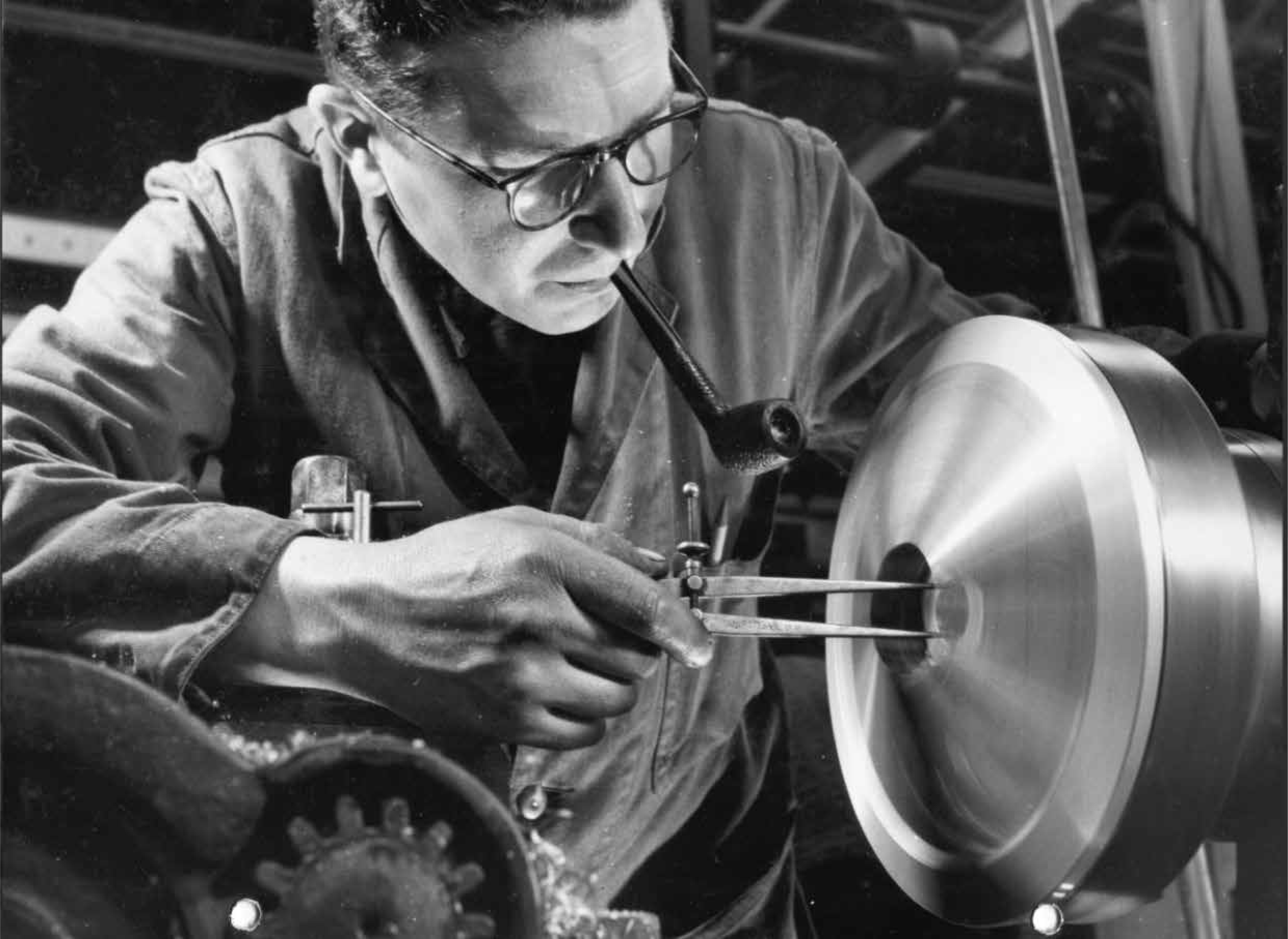 black and white picture of engineer working on injectors