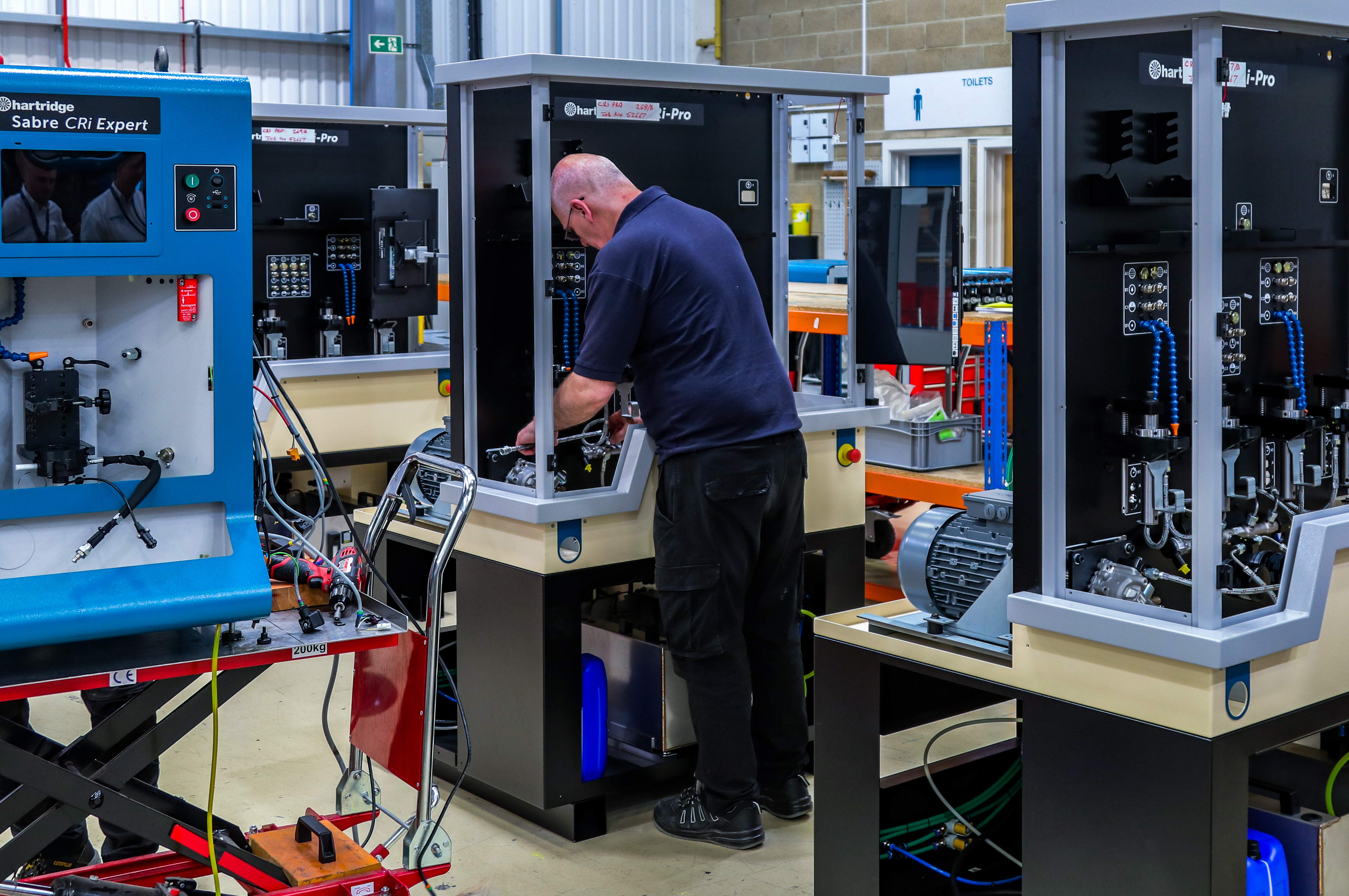 Hartridge technician working on a new test bench