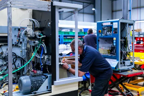 Hartridge worskshop with technicians working on test benches